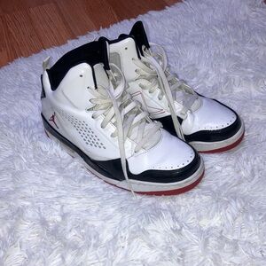 White and Black Sneakers with Red Accents